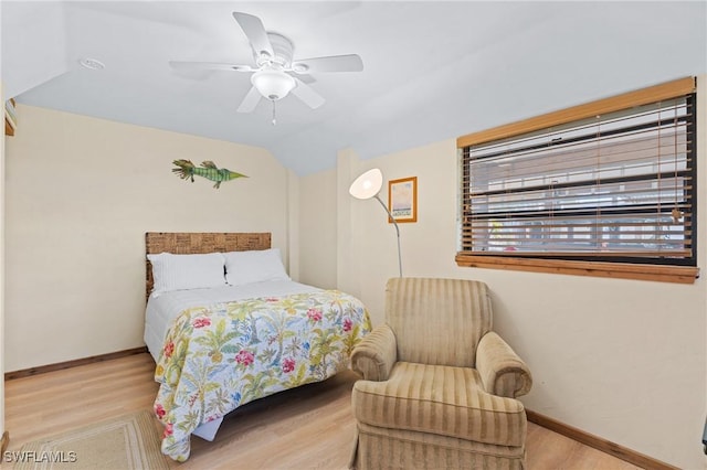 3627 Clipper Ln, Saint James City, FL 33956 - bedroom with wood finished floors, vaulted ceiling, baseboards, and a ceiling fan