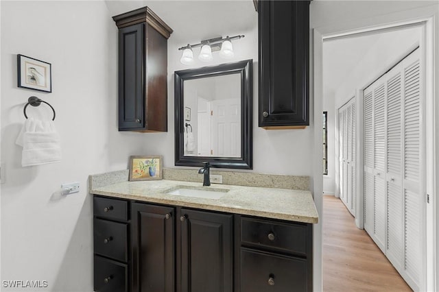 3627 Clipper Ln, Saint James City, FL 33956 - bathroom with vanity and wood finished floors