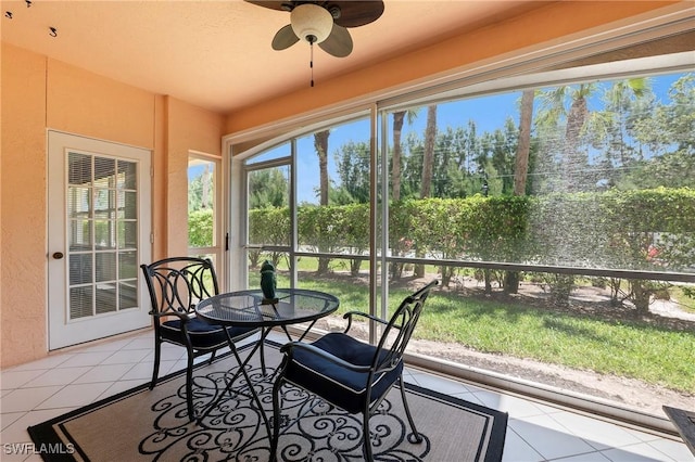 1044 Woodshire Ln Unit B102, Naples, FL 34105 - sunroom with tile patterned flooring, a ceiling fan, and outdoor dining space