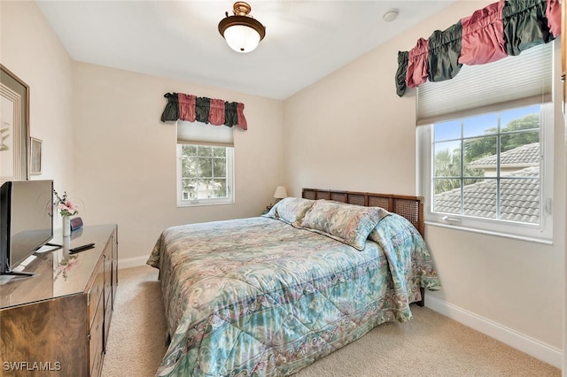 28686 San Galgano Way, Bonita Springs, FL 34135 - carpeted bedroom featuring baseboards