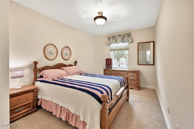 28686 San Galgano Way, Bonita Springs, FL 34135 - bedroom featuring light carpet and baseboards