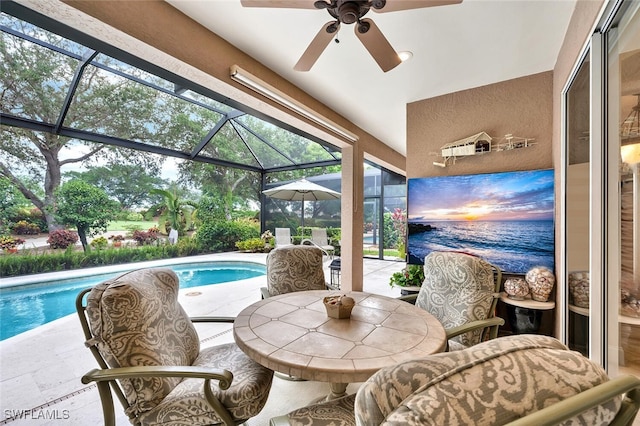 28686 San Galgano Way, Bonita Springs, FL 34135 - sunroom featuring a ceiling fan, a pool, and lofted ceiling