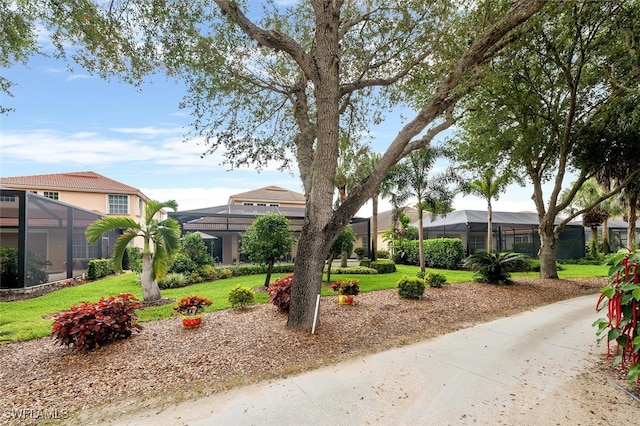 28686 San Galgano Way, Bonita Springs, FL 34135 - view of front of property with a front yard and a lanai