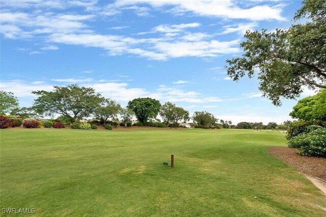 28686 San Galgano Way, Bonita Springs, FL 34135 - view of community with golf course view and a lawn