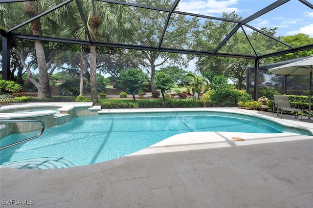 28686 San Galgano Way, Bonita Springs, FL 34135 - view of pool featuring a patio area, a pool with connected hot tub, and glass enclosure