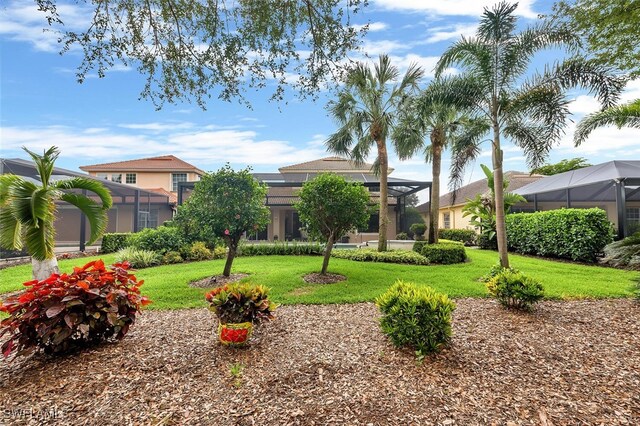 28686 San Galgano Way, Bonita Springs, FL 34135 - view of front of house with a front lawn, a lanai, and stucco siding