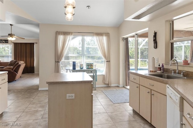 718 Willard Ave, Lehigh Acres, FL 33972 - kitchen featuring a sink, dishwasher, lofted ceiling, healthy amount of natural light, and light tile patterned flooring