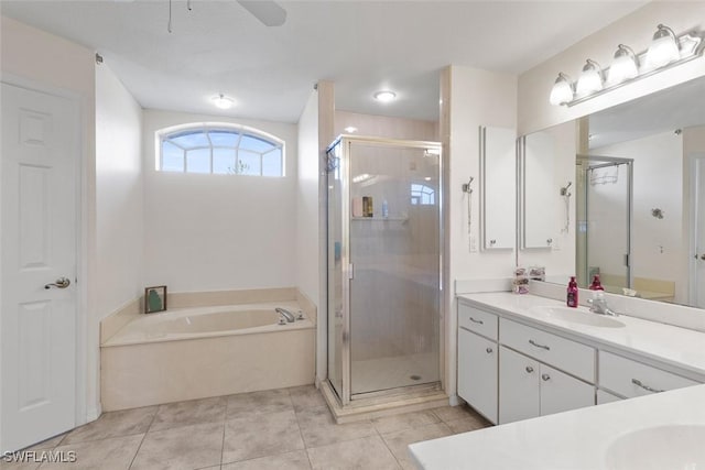718 Willard Ave, Lehigh Acres, FL 33972 - bathroom featuring vanity, a bath, a stall shower, tile patterned floors, and a ceiling fan