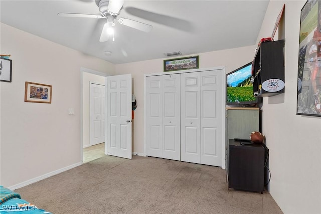 718 Willard Ave, Lehigh Acres, FL 33972 - carpeted bedroom featuring a ceiling fan, a closet, and baseboards