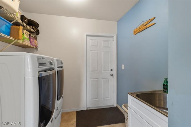 718 Willard Ave, Lehigh Acres, FL 33972 - laundry room featuring washing machine and clothes dryer, baseboards, and light tile patterned flooring