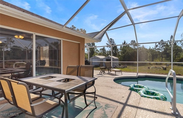 718 Willard Ave, Lehigh Acres, FL 33972 - view of patio with an outdoor pool, glass enclosure, and outdoor dining space
