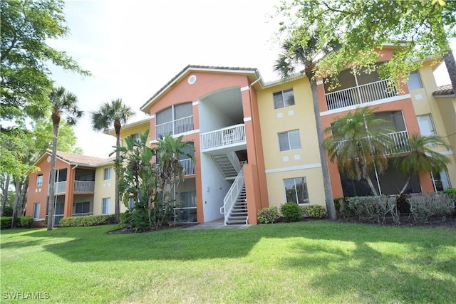 6481 Aragon Way Unit 205, Fort Myers, FL 33966 - view of apartment building / complex featuring stairs