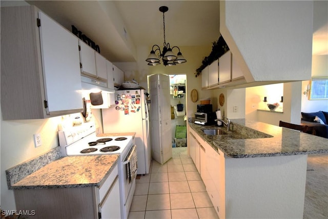 6481 Aragon Way Unit 205, Fort Myers, FL 33966 - kitchen with white appliances, a sink, a peninsula, a chandelier, and stone counters