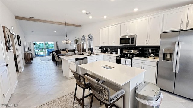 14257 Heritage Landing Blvd Unit 1122, Punta Gorda, FL 33995 - kitchen featuring appliances with stainless steel finishes, a peninsula, backsplash, a chandelier, and recessed lighting