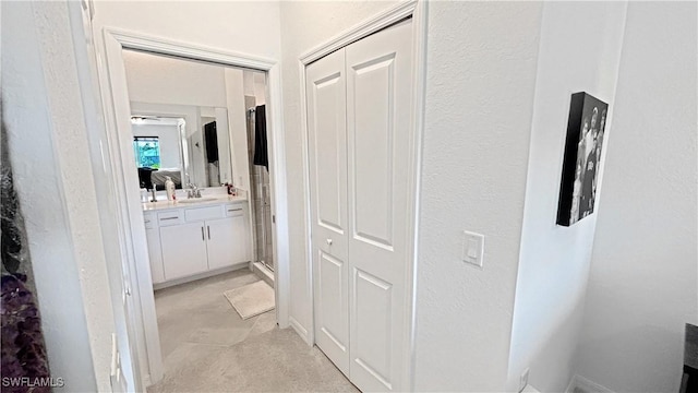 14257 Heritage Landing Blvd Unit 1122, Punta Gorda, FL 33995 - corridor featuring a sink