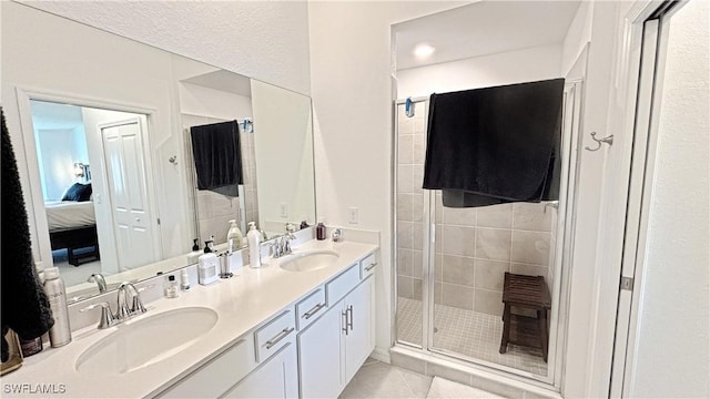 14257 Heritage Landing Blvd Unit 1122, Punta Gorda, FL 33995 - full bath with double vanity, a stall shower, connected bathroom, and tile patterned flooring