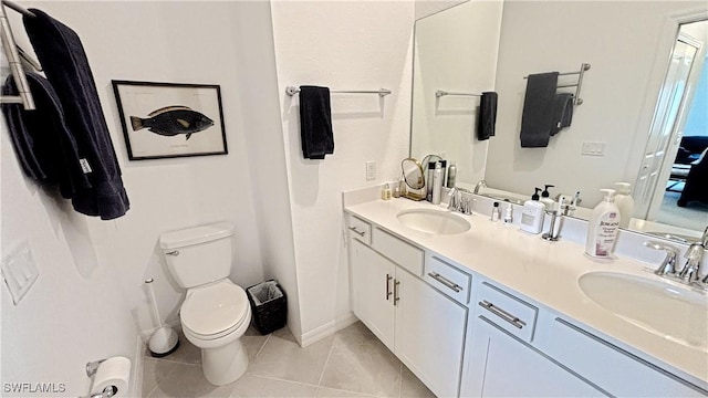 14257 Heritage Landing Blvd Unit 1122, Punta Gorda, FL 33995 - bathroom featuring double vanity, toilet, tile patterned floors, and baseboards