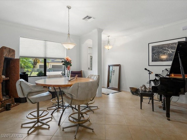 3913 Sapphire Way, Naples, FL 34114 - dining space with ornamental molding, light tile patterned floors, and arched walkways