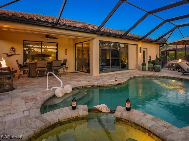 3913 Sapphire Way, Naples, FL 34114 - view of pool with a pool with connected hot tub, a patio, ceiling fan, outdoor dining area, and glass enclosure
