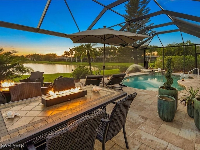 3913 Sapphire Way, Naples, FL 34114 - view of swimming pool featuring an outdoor fire pit, a patio area, a water view, and glass enclosure