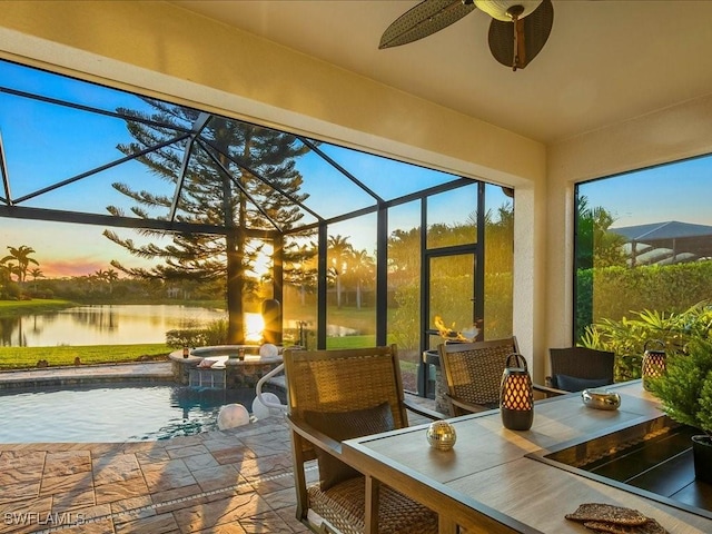 3913 Sapphire Way, Naples, FL 34114 - sunroom featuring a hot tub, a ceiling fan, a water view, and outdoor dining space