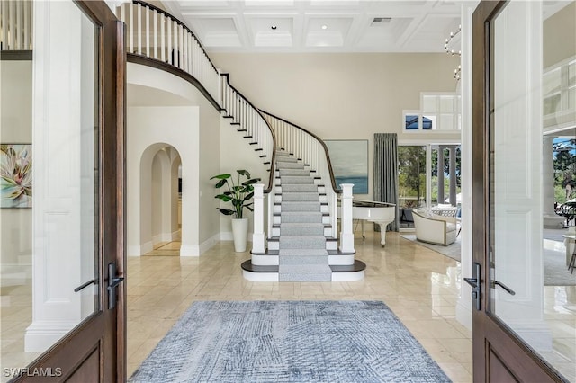 4111 Harbor Oaks Ct, Bonita Springs, FL 34134 - entrance foyer with a high ceiling, arched walkways, coffered ceiling, french doors, and beamed ceiling