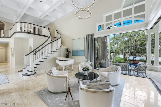 4111 Harbor Oaks Ct, Bonita Springs, FL 34134 - living area with a towering ceiling, coffered ceiling, stairway, beam ceiling, and a chandelier