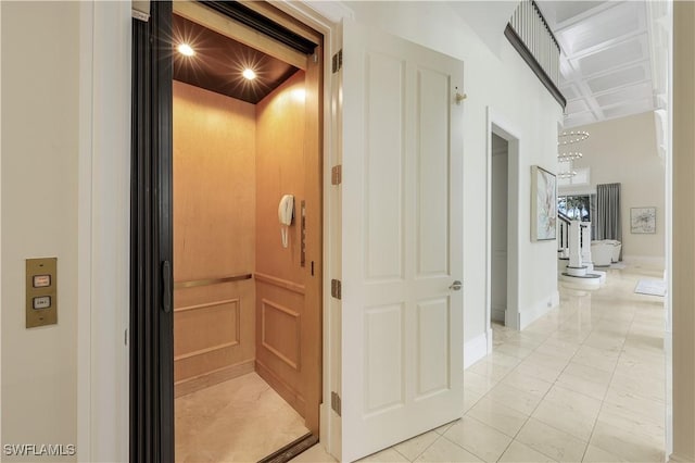 4111 Harbor Oaks Ct, Bonita Springs, FL 34134 - hall featuring elevator, light marble finish flooring, and a chandelier