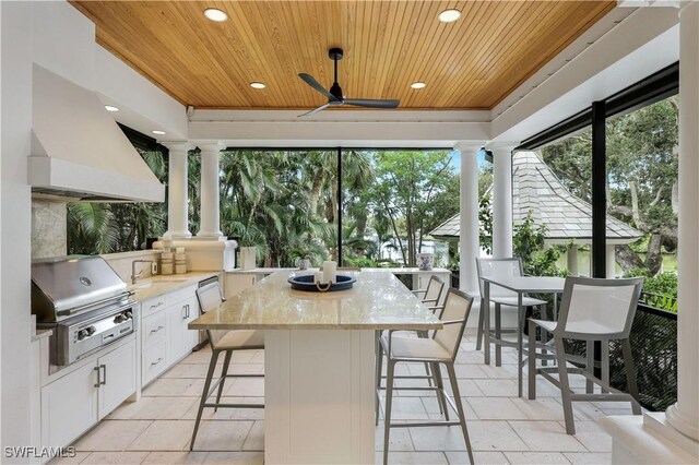 4111 Harbor Oaks Ct, Bonita Springs, FL 34134 - view of patio / terrace with an outdoor kitchen, a ceiling fan, and outdoor dining area