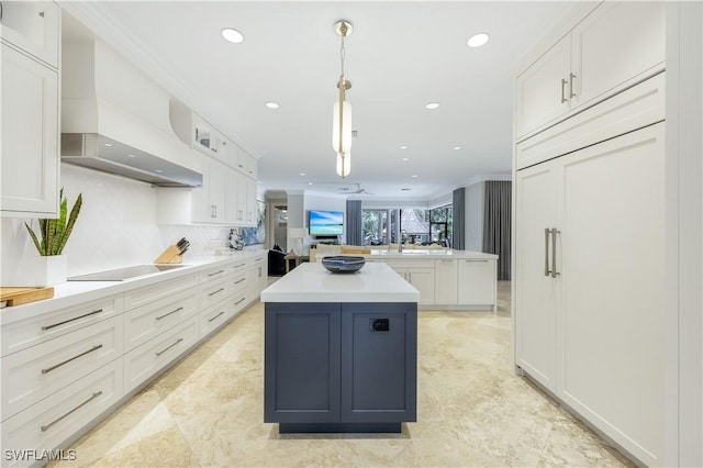 4111 Harbor Oaks Ct, Bonita Springs, FL 34134 - kitchen featuring a center island, black electric cooktop, white cabinets, hanging light fixtures, and recessed lighting
