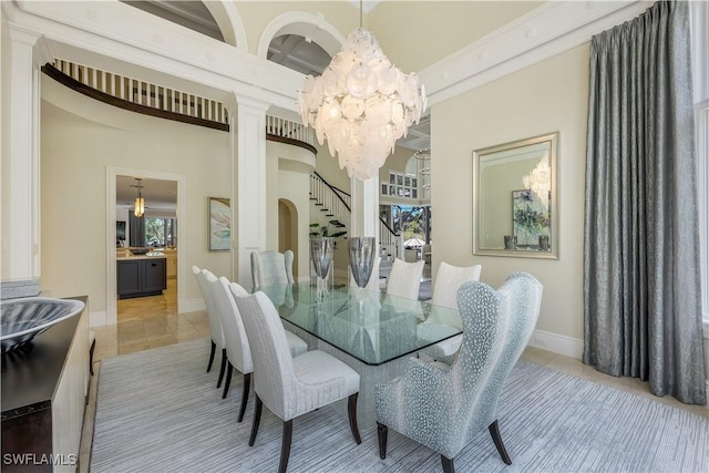 4111 Harbor Oaks Ct, Bonita Springs, FL 34134 - dining space with a chandelier, light tile patterned floors, and stairs