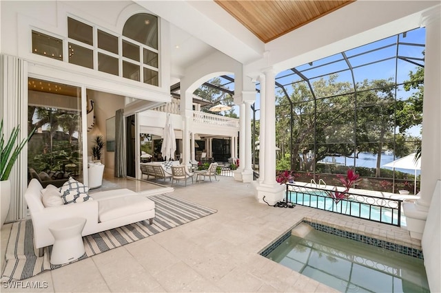 4111 Harbor Oaks Ct, Bonita Springs, FL 34134 - view of patio featuring an outdoor pool, glass enclosure, an in-ground hot tub, and an outdoor hangout area