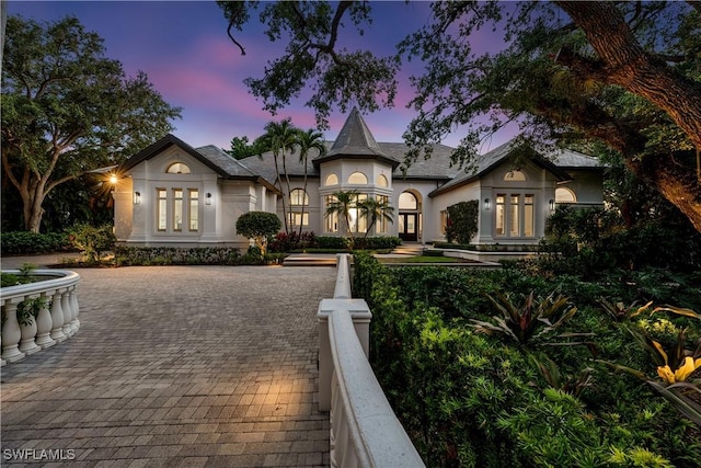 4111 Harbor Oaks Ct, Bonita Springs, FL 34134 - view of front of house with french doors and stucco siding