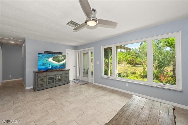 13951 Rod And Gun Club Rd, Fort Myers, FL 33913 - unfurnished living room with ceiling fan and baseboards