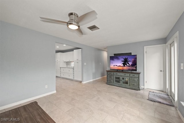 13951 Rod And Gun Club Rd, Fort Myers, FL 33913 - unfurnished living room with a ceiling fan and baseboards