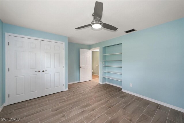 13951 Rod And Gun Club Rd, Fort Myers, FL 33913 - unfurnished bedroom with wood finished floors, baseboards, and a ceiling fan