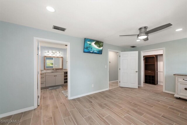 13951 Rod And Gun Club Rd, Fort Myers, FL 33913 - unfurnished bedroom featuring light wood-type flooring, baseboards, and recessed lighting