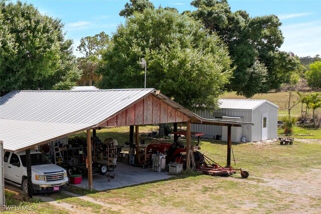 13951 Rod And Gun Club Rd, Fort Myers, FL 33913 - view of vehicle parking with a carport and dirt driveway