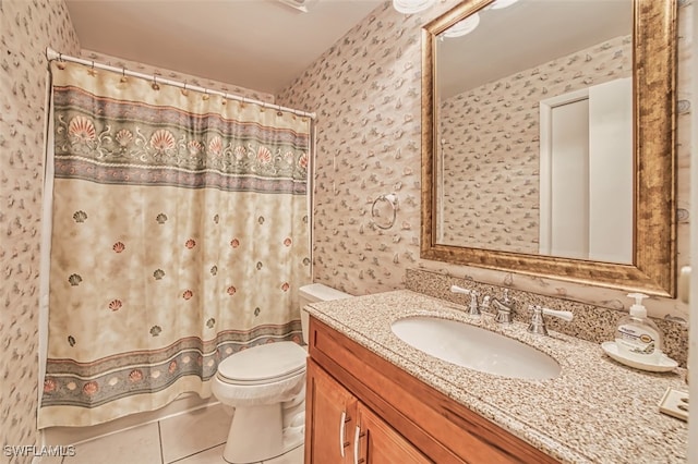 8061 S Woods Cir Unit 4, Fort Myers, FL 33919 - bathroom with wallpapered walls, vanity, toilet, tile patterned floors, and a shower with curtain