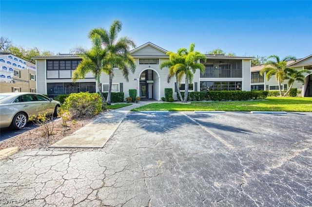 8061 S Woods Cir Unit 4, Fort Myers, FL 33919 - view of building exterior featuring uncovered parking