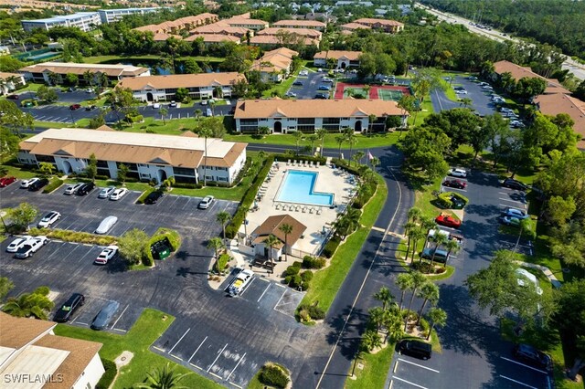 8061 S Woods Cir Unit 4, Fort Myers, FL 33919 - aerial overview of property's location featuring a pool area