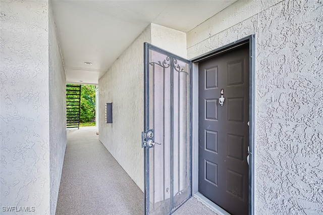8061 S Woods Cir Unit 4, Fort Myers, FL 33919 - view of exterior entry with stucco siding