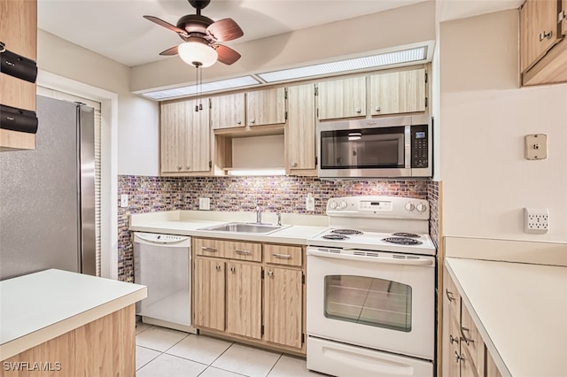8061 S Woods Cir Unit 4, Fort Myers, FL 33919 - kitchen with appliances with stainless steel finishes, a sink, light countertops, and light tile patterned flooring