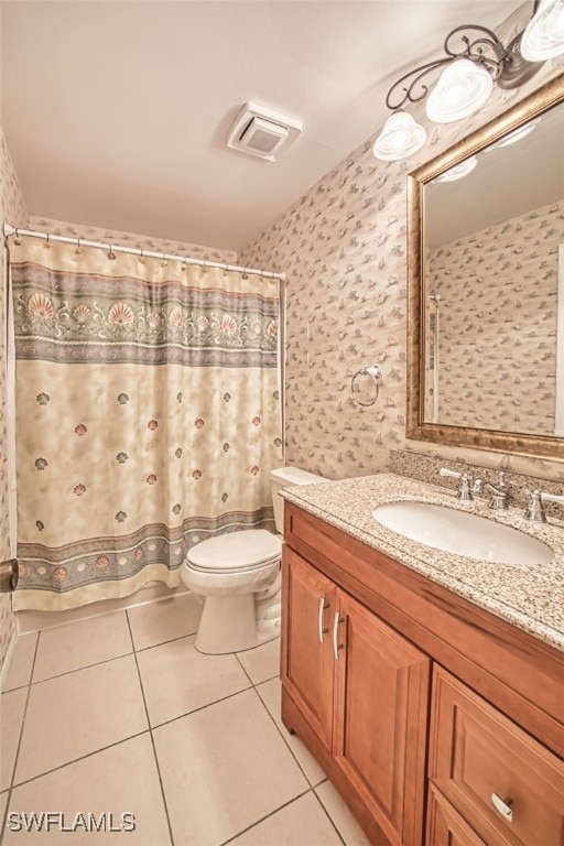 8061 S Woods Cir Unit 4, Fort Myers, FL 33919 - full bathroom with wallpapered walls, vanity, tile patterned flooring, and toilet