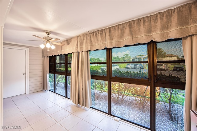 8061 S Woods Cir Unit 4, Fort Myers, FL 33919 - doorway to outside featuring tile patterned floors and ceiling fan