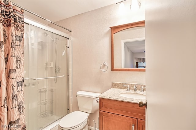 8061 S Woods Cir Unit 4, Fort Myers, FL 33919 - bathroom featuring a stall shower, toilet, and vanity