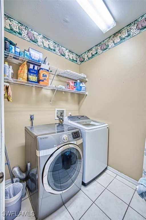 9201 Middle Oak Dr, Fort Myers, FL 33967 - laundry room with independent washer and dryer and light tile patterned floors