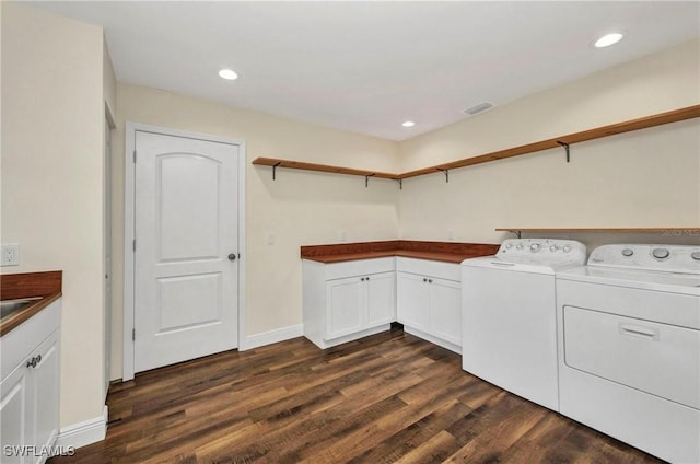 6405 Alan Blvd, Punta Gorda, FL 33982 - laundry room with washer and clothes dryer, dark wood-style flooring, recessed lighting, baseboards, and cabinet space