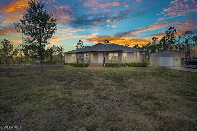 6405 Alan Blvd, Punta Gorda, FL 33982 - view of front of house featuring covered porch, an outdoor structure, a detached garage, a front lawn, and driveway