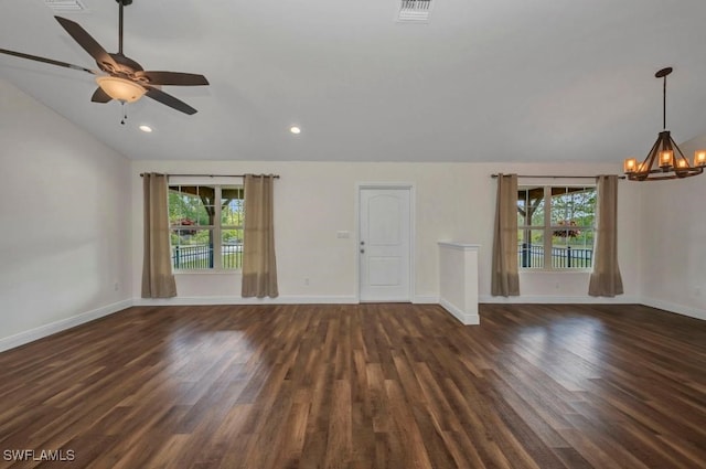 6405 Alan Blvd, Punta Gorda, FL 33982 - unfurnished living room with a chandelier, vaulted ceiling, plenty of natural light, wood finished floors, and a ceiling fan